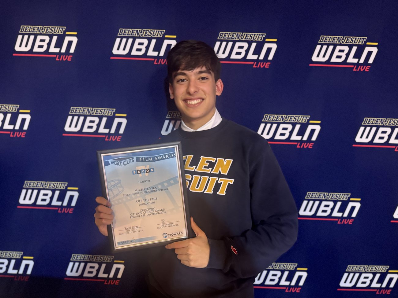 Holding the Short Cuts Critics' Choice Award certificate